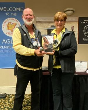 Couple Holding an Award