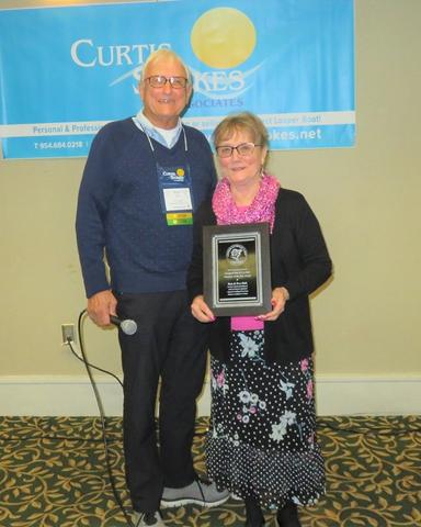 Couple Holding an Award