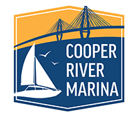 Cooper River Marina logo with yellow and blue background, white sailboat, with bridge in the background