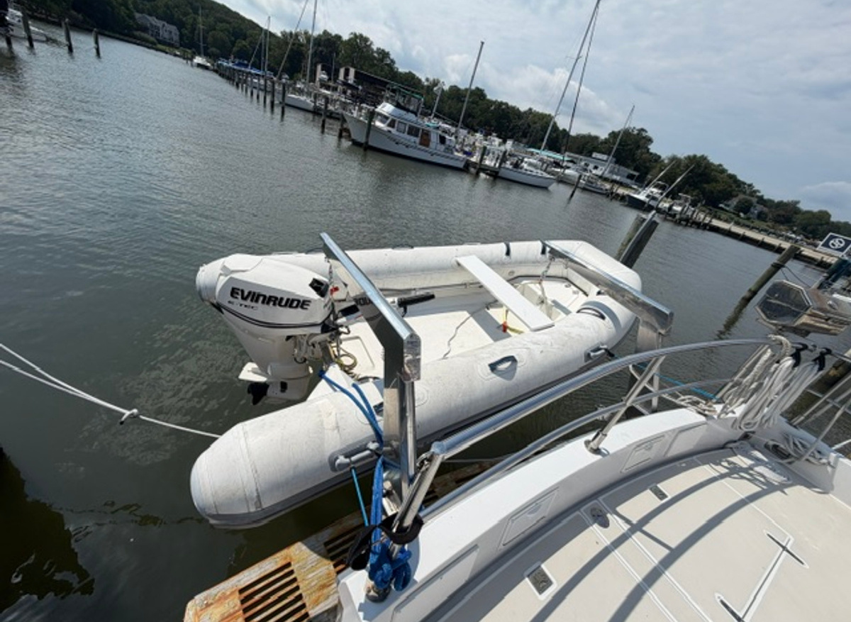 Image of Evinrude 25hp outboard motor and Mercury Dinghy