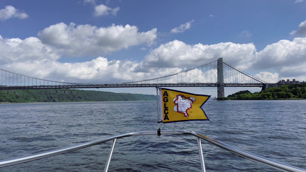 Burgee Flying on Boat Approaching Bridge