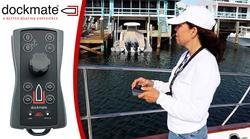 Woman standing on boat coming in to dock with device in her hand